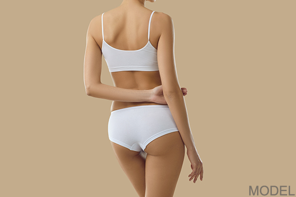 Woman's back in white underwear