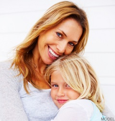 Woman hugging a young girl