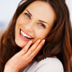 Woman with long brown hair laughing